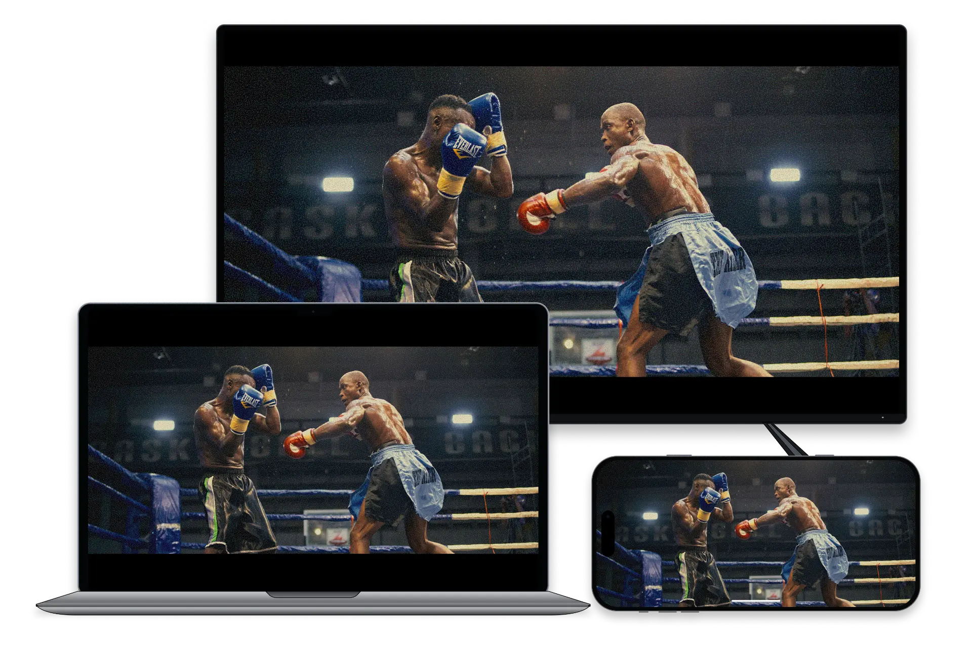 A boxing event playing at the same time on a TV, a laptop and a phone